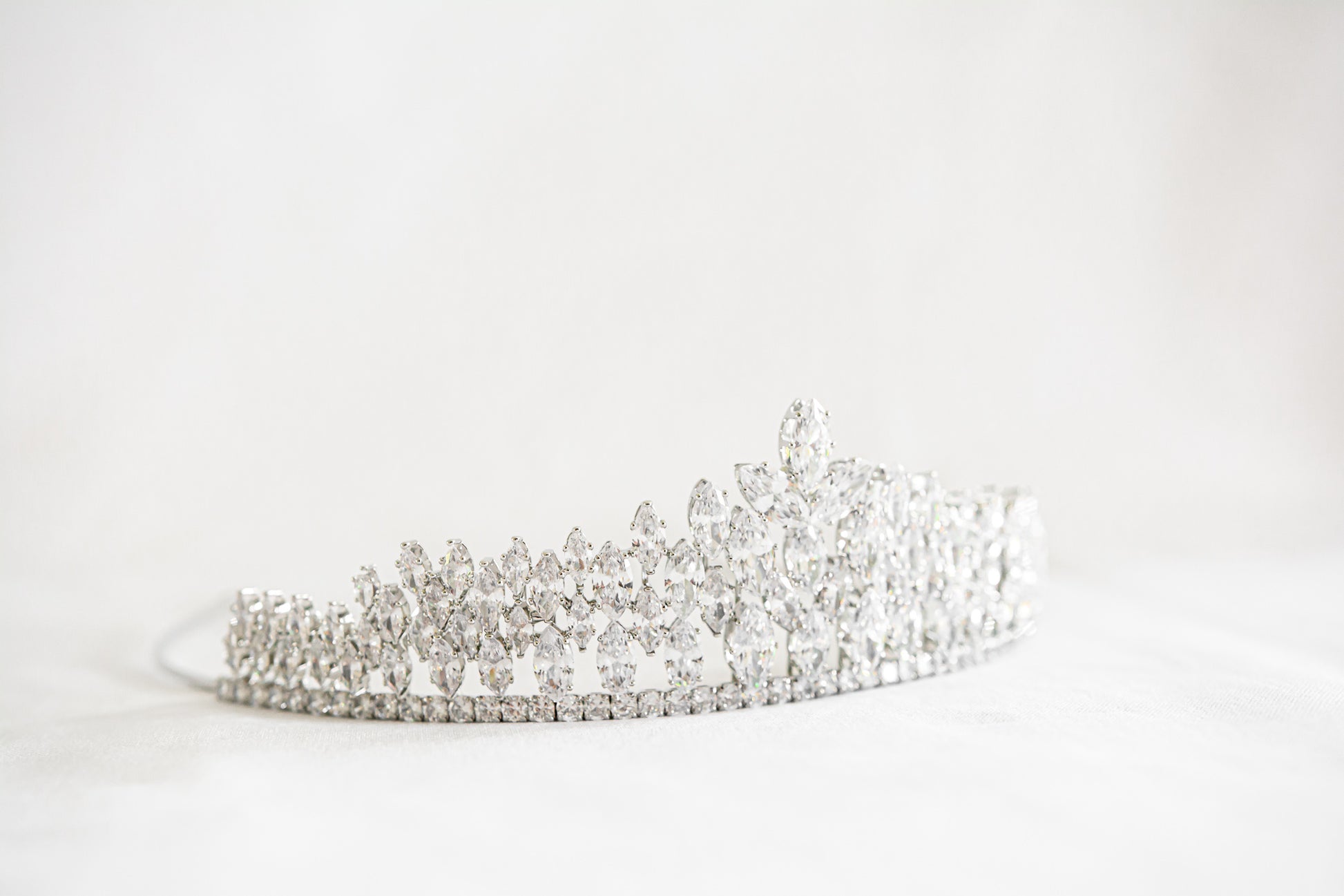 A dazzling tiara showcasing diamonds on a white background